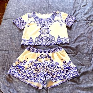 2 piece outfit. Cropped top and shorts with pockets. Thicker polyesters blend.